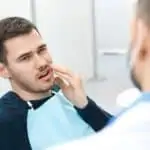 Man in dental chair with toothache