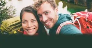 Camping couple smile with straight white teeth